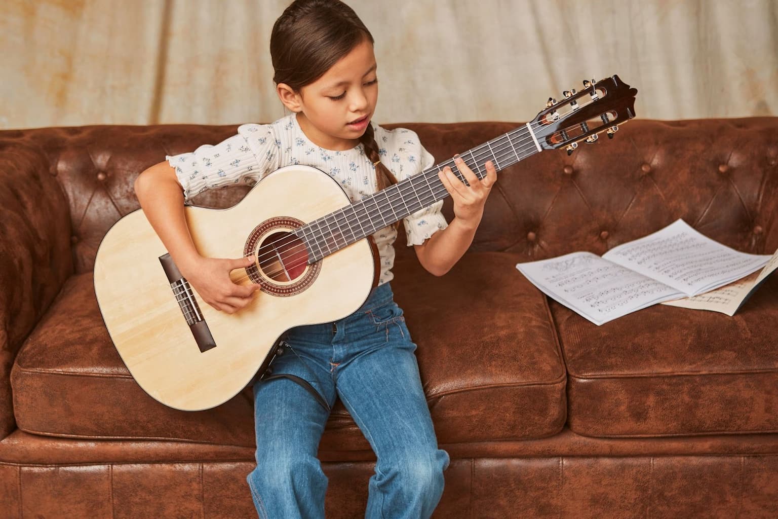 the girl playing guitar